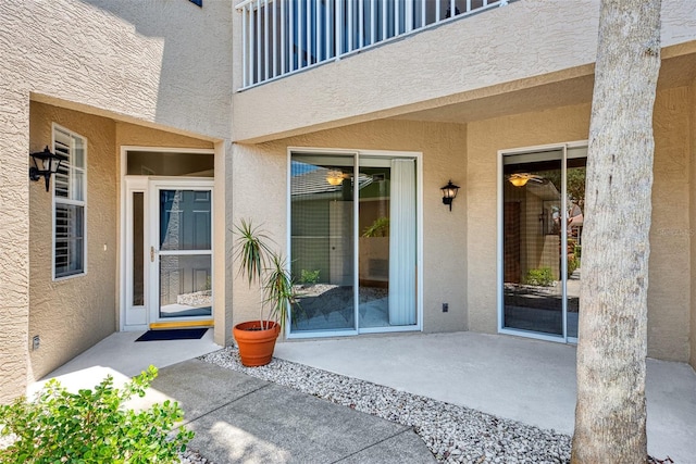 doorway to property with a patio