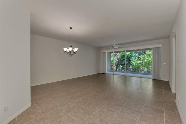 spare room featuring ceiling fan with notable chandelier and light tile patterned floors