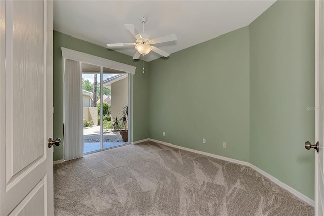 empty room featuring carpet and ceiling fan