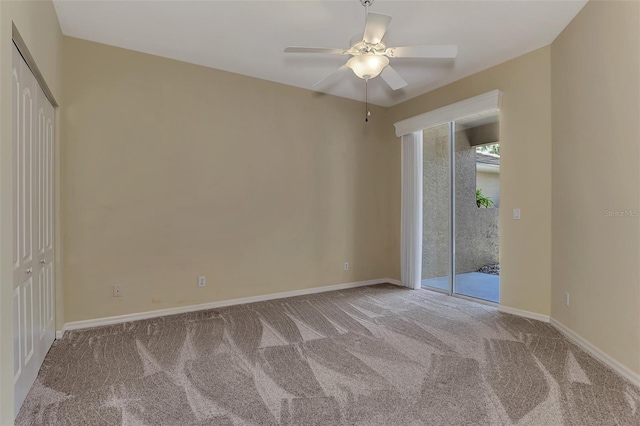 spare room featuring ceiling fan and light colored carpet