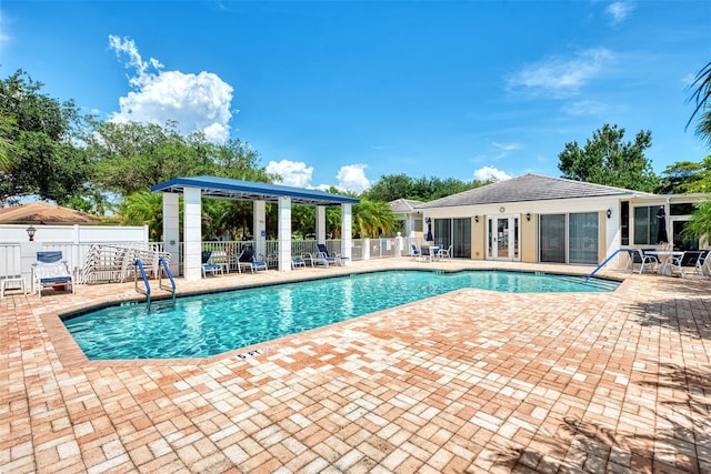 view of swimming pool with a patio area