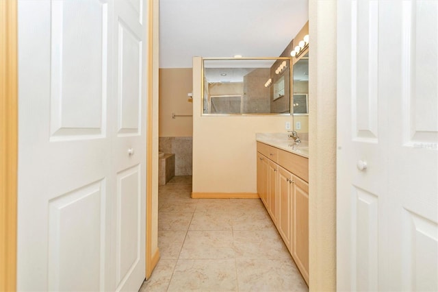 bathroom with tile patterned flooring and vanity