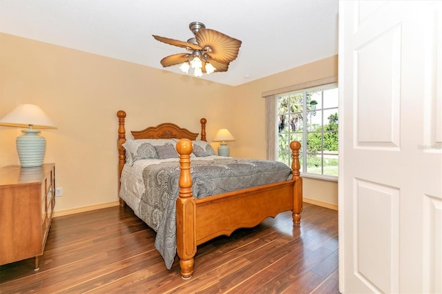 bedroom with ceiling fan and dark wood-type flooring