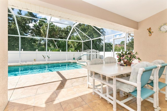 view of pool featuring a patio, a storage shed, and a lanai