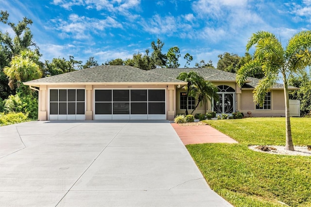 single story home with a front yard and a garage