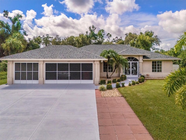 ranch-style home with a garage and a front lawn