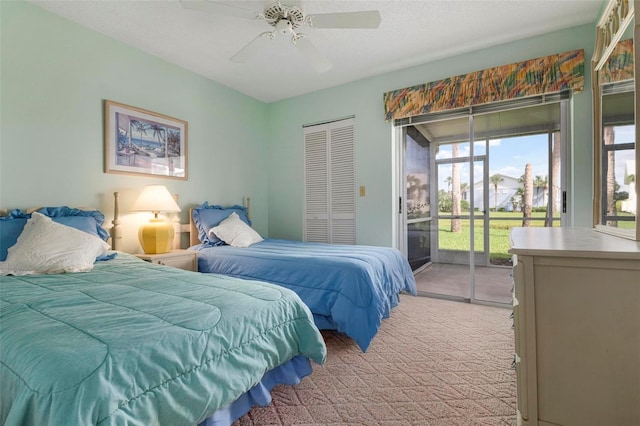 bedroom with access to outside, ceiling fan, light colored carpet, and a closet