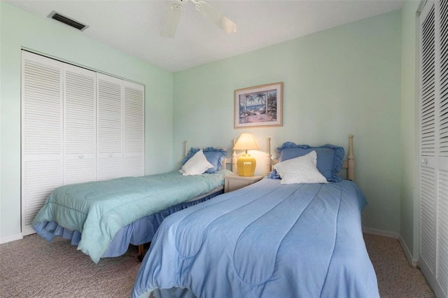 carpeted bedroom featuring ceiling fan and a closet