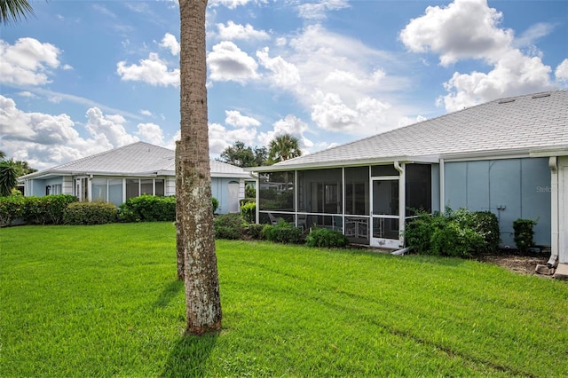 view of yard with a sunroom