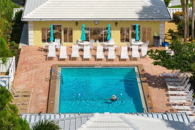 view of pool featuring a patio area