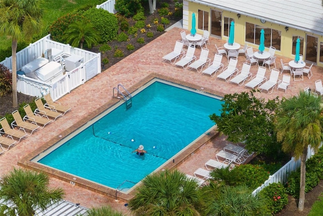 view of swimming pool with a patio