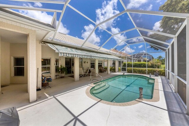 view of pool featuring a lanai and a patio area