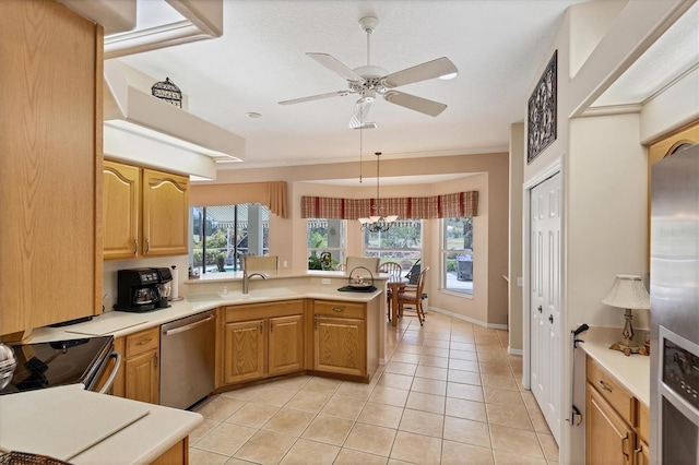 kitchen with pendant lighting, stainless steel appliances, kitchen peninsula, and a wealth of natural light