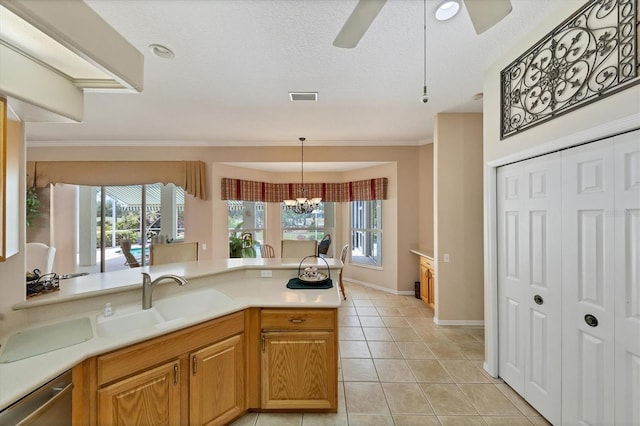 kitchen featuring dishwasher, a textured ceiling, light tile patterned flooring, sink, and ceiling fan with notable chandelier