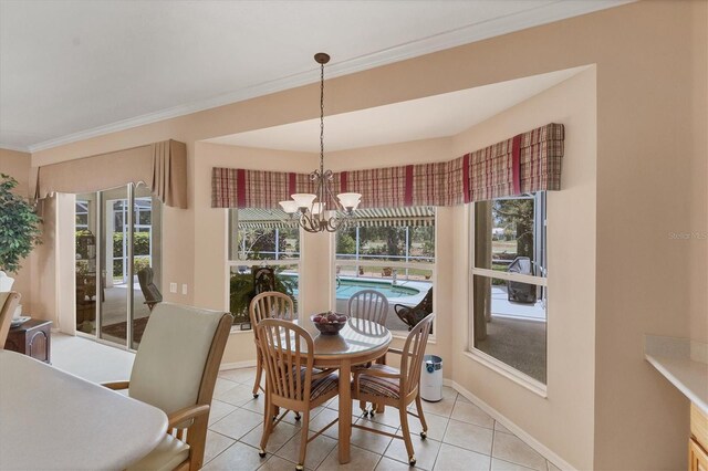 dining area with plenty of natural light, light tile patterned floors, crown molding, and a chandelier