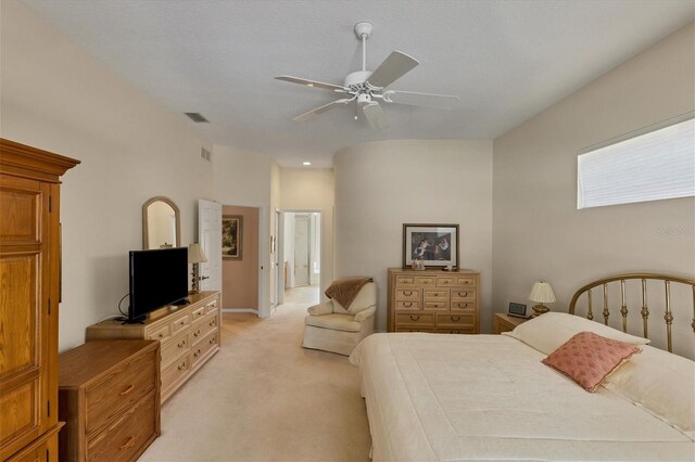 bedroom with ceiling fan and light colored carpet