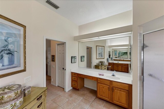 bathroom with vanity, tile patterned floors, a textured ceiling, and an enclosed shower