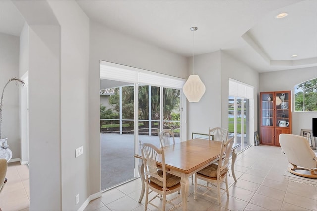 dining space with light tile patterned floors