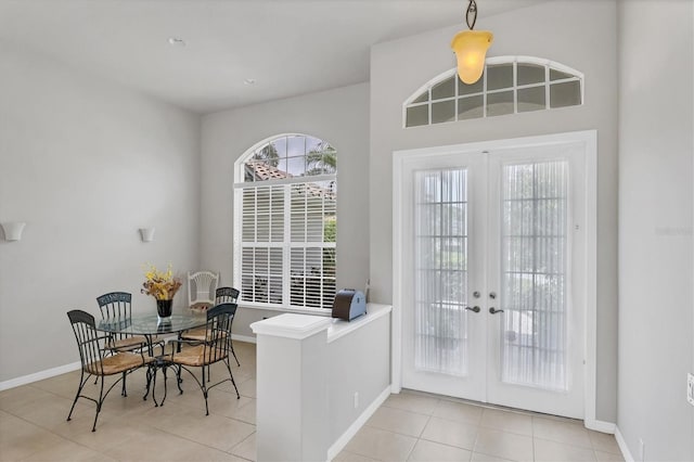 doorway with french doors and light tile patterned floors