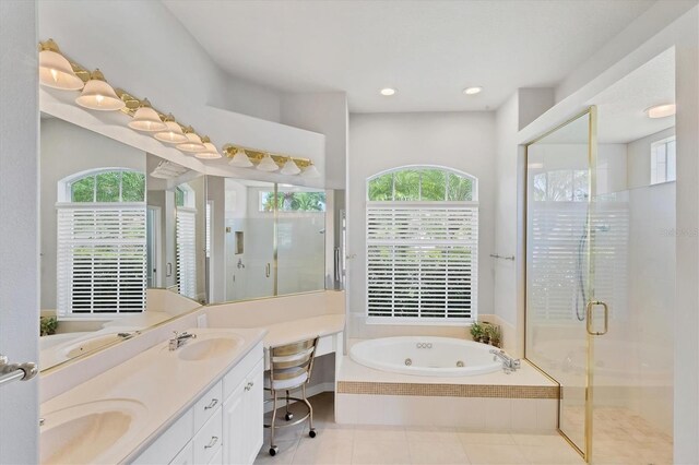 bathroom featuring vanity, separate shower and tub, tile patterned floors, and a wealth of natural light