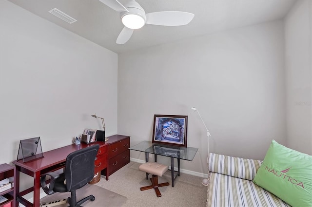 carpeted office featuring ceiling fan