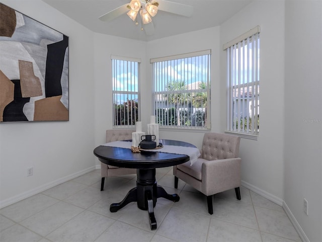 sitting room featuring ceiling fan and light tile patterned flooring