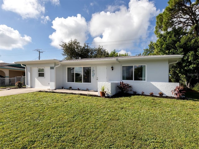 ranch-style home with a front yard