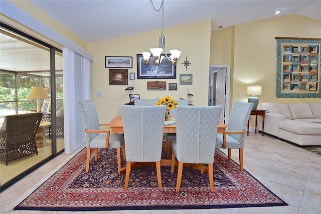 tiled dining room with lofted ceiling and a chandelier