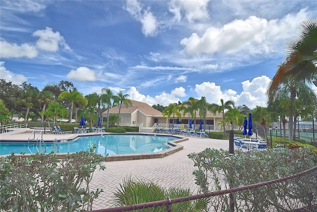 view of pool featuring a patio