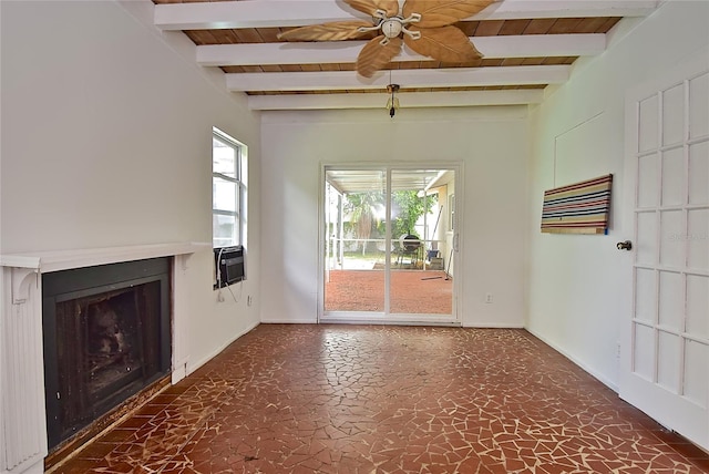 unfurnished living room featuring ceiling fan and beamed ceiling