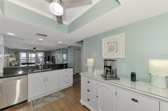 kitchen featuring ornamental molding, sink, white cabinetry, dishwasher, and light hardwood / wood-style floors