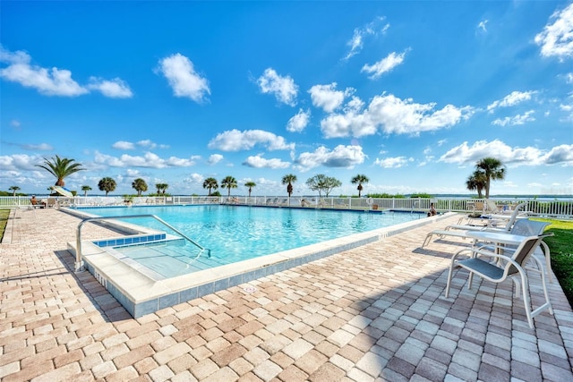 view of swimming pool with a patio