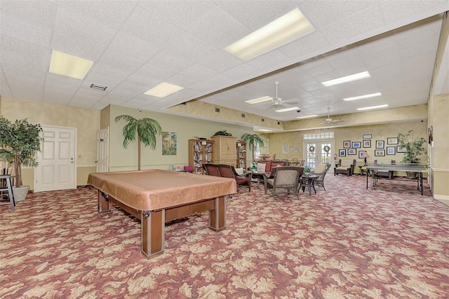 recreation room with a drop ceiling, pool table, ceiling fan, and carpet floors