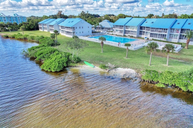 birds eye view of property featuring a water view