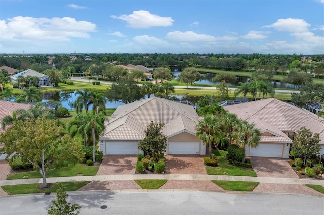 birds eye view of property with a water view