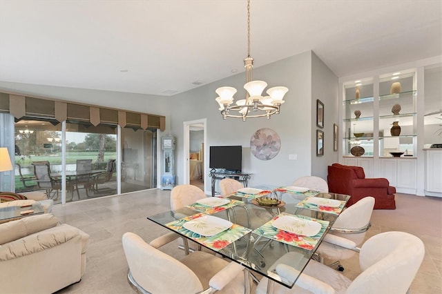 dining space with lofted ceiling, a chandelier, and light tile patterned floors