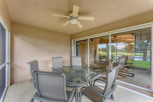 sunroom with ceiling fan