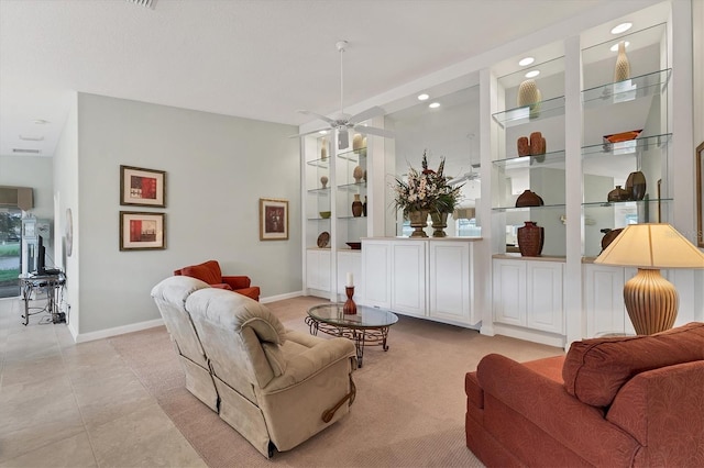 tiled living room with ceiling fan