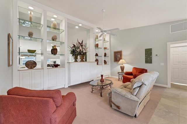 tiled living room featuring ceiling fan