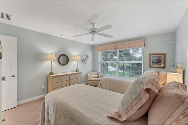 bedroom with ceiling fan and light colored carpet