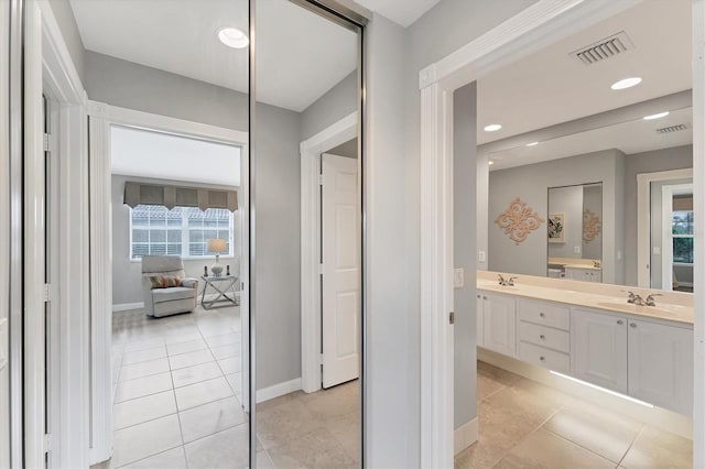 bathroom featuring vanity, tile patterned floors, and a wealth of natural light