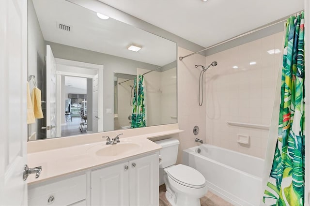 full bathroom featuring vanity, shower / bath combination with curtain, and toilet