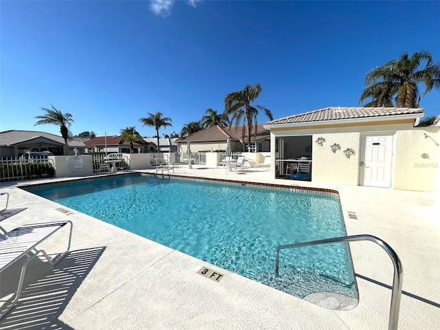 view of swimming pool with a patio