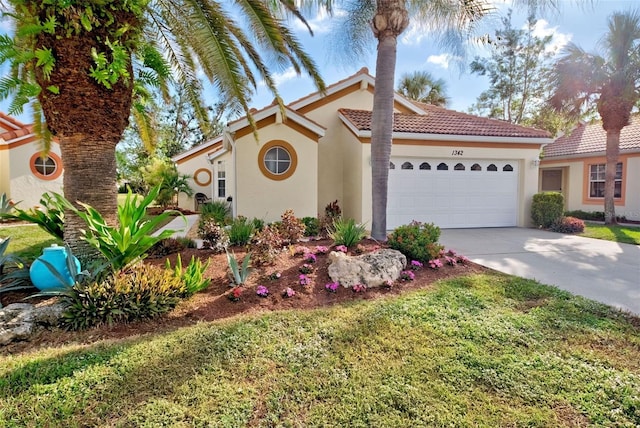 mediterranean / spanish-style home featuring a garage