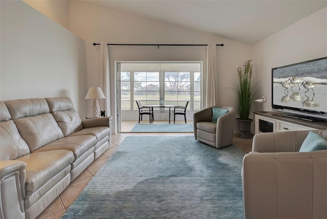 tiled living room with french doors and lofted ceiling