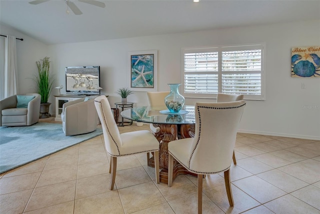 dining room with ceiling fan and light tile patterned flooring