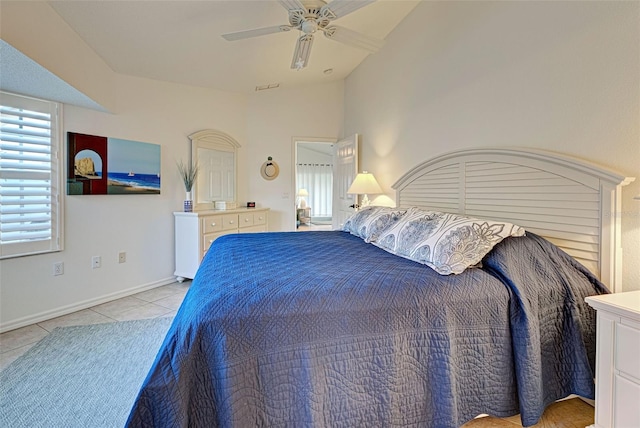 tiled bedroom with ceiling fan