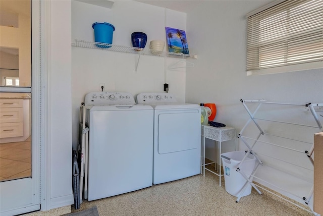 washroom featuring washer and dryer