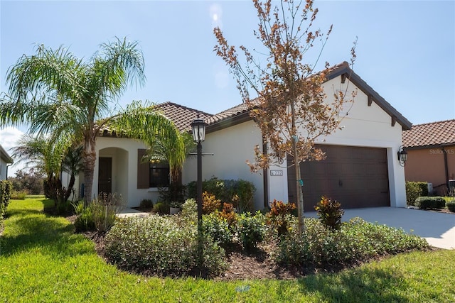 232 Carlino Dr, Nokomis, FL 34275 - mediterranean / spanish house with a garage, driveway, a tiled roof, and stucco siding