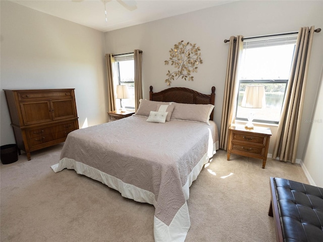 carpeted bedroom featuring ceiling fan